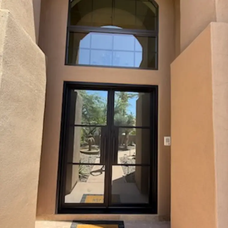 Single entry under an arch window
